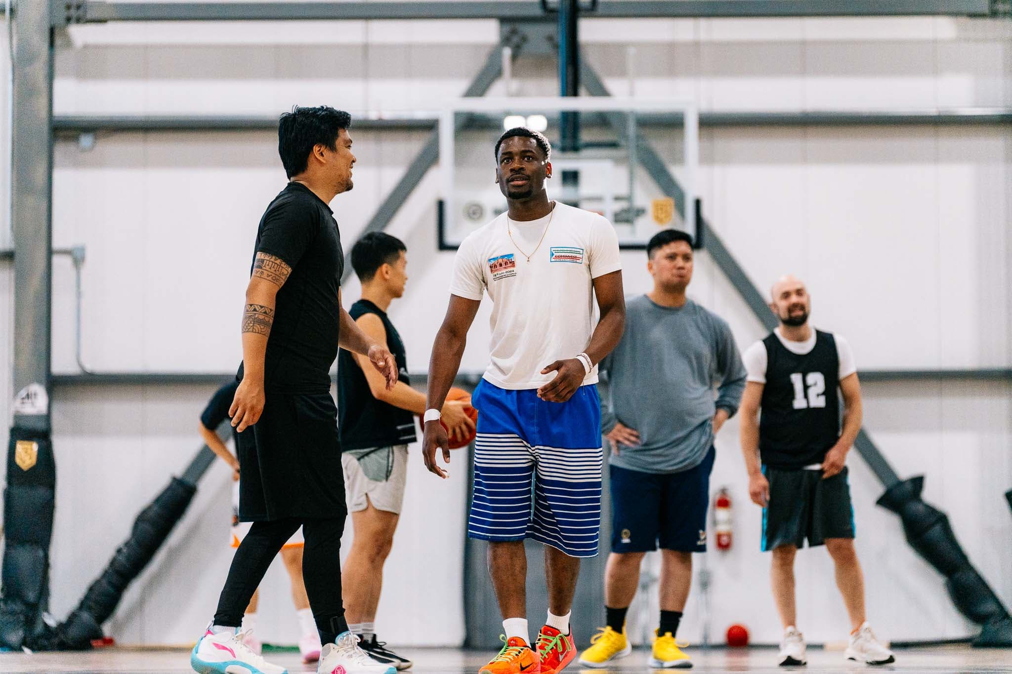 Players talking it over on the court between games